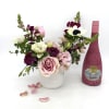 Joyful and celebratory gift set that includes a whimsical, soft pink floral