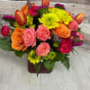 HOT To Go is a bold and fiery floral arrangement designed to