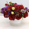 Send your hugs and kisses with this beautiful arrangement of roses, lisianthus