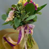This handheld bouquet features Gerbera Daisies, Roses, Peruvian Lilies, surrounded by Eucalyptus.
