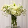 The perfect all white arrangement to send for sympathy or just to