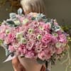 Pink heaven floral arrangement consists of two types of roses, hydrangea, ranunculus