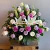 The basket is artistically designed by our florist with lavender and white