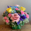 Designer&#039;s choice of blue hydrangea, yellow roses, pink carnations, iris, and mini
