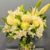 Beautiful white bouquet with different types of flowers.