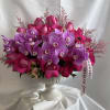 Purple Phalaenopsis orchids are elegant, exotic blooms that symbolize admiration, royalty, and