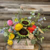A Designer&rsquo;s Choice boxed arrangement filled with a variety of blooms in
