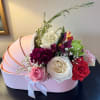 Fresh seasonal flowers in a cradle flower box to celebrate the new
