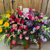 Honor a bright, beautiful life with this colorful burst of hydrangea, roses