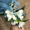 Freesia corsage with baby breath.