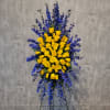 Easel spray featuring blue delphinium - the closest cut flower on the