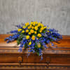 Casket spray featuring blue delphinium - the closest cut flower on the