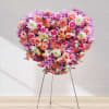 In Loving Radiance is a stunning heart-shaped funeral spray crafted to express