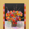 A striking display of fresh tulips in fiery shades of red, orange