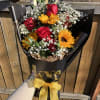 Wrapped sunflowers tucked elegantly in black and gold perfect for that special