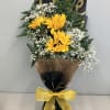 Wrapped sunflowers tucked elegantly in black and gold perfect for that special