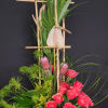 Protea on a bed of roses sets the tone for this powerhouse!