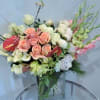 Order this stunning arrangement with roses, anthurium, calla lilies, peonies, orchids, and