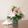 A truly gorgeous piece featuring stunning stargazer lilies and a dozen premium