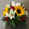 Sunflowers and roses, designer choice of spring flowers.