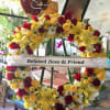 Open ring Wreath with roses and lilies and other spring flowers 