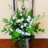 A mixed fresh cut consisting of White Lisianthus, White Larkspur, Green Hydrangeas