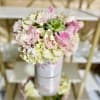 Classic and Beautiful, this arrangement whispers luxury. Soft pinks, whites and creams