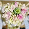 Classic and Beautiful, this arrangement whispers luxury. Soft pinks, whites and creams