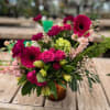 An array of various shades of pink and green, featuring gerbera daisies