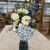 A dazzling mix of whites and blues make this vase a true