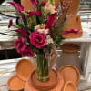 Calla lily, garden rose, and snapdragons bring this beauty to life!