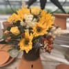 Beautiful sunflowers mixed with greens and other yellows