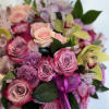 Roses, Spray Roses , Orchids in a ceramic vase. 