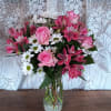 Soft and delicate, this pale pink and white bouquet speaks to the