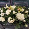 Beautifully crafted casket cover in whites in greens, as delicate as Angel&#039;s
