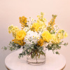 A vibrant arrangement that boast with a beam of sunshine. This arrangement
