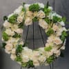 A beautiful white and green tribute wreath that calms, this easel arrangement