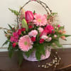 A Spring Time floral basket with an assortment of
gerbera daisies, tulips,roses, iris