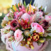 Showcasing Hawaii&rsquo;s finest blooms in a heartfelt arrangement with mixed tropicals and