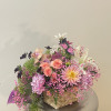 This mixed floral arrangement is perfect for any dining room table 