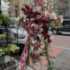 This elegant standing spray is designed in the shape of a graceful