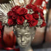 Designed in a silver Grecian-style bust vase, this unique floral piece blends