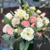 Shades of soft pinks and whites containing unique flowers including Butterfly Ranunculus