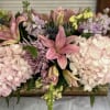 Almost 2 feet long, these lovely lilies, fluffy hydrangeas, lavender roses and