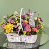 A Charming Basket Filled With A Vibrant mix Of Flowers Accompanied By