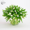 A large white arrangement made entirely from 100 tulips. 