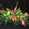 Luxurious exotic tropical flowers in a low dining table Centerpiece. Ginger, Anthurium