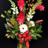 Tall striking display of Bright, Vibrant flowers. Tropical and seasonal selection will