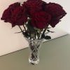 12 fresh cut roses of your choice arranged delicately in a large