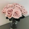 12 fresh cut roses of your color choice arranged delicately in a